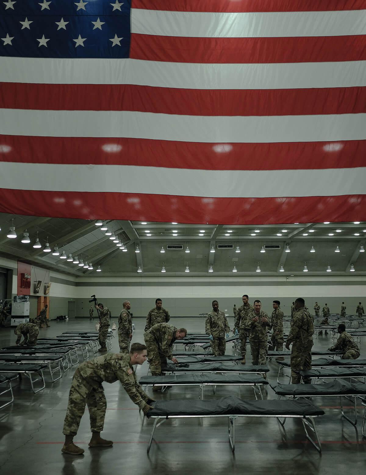 A picture of the National Guard as they Set Up a Field Hospital in the Baltimore Convention Center.