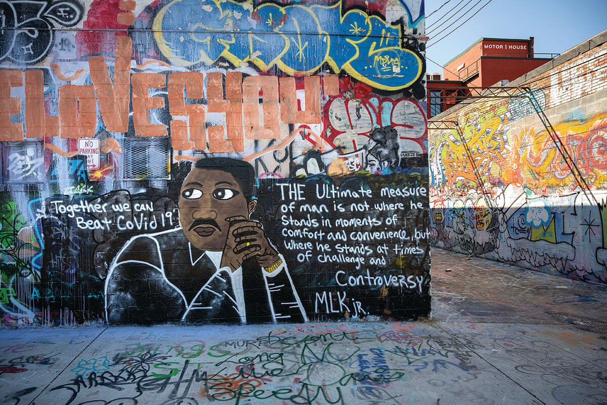 A picture of Graffiti Alley with a Martin Luther King Jr. quote painted on the wall.