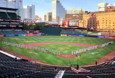  The players socially distance during the National Anthem. Corey McLaughlin 