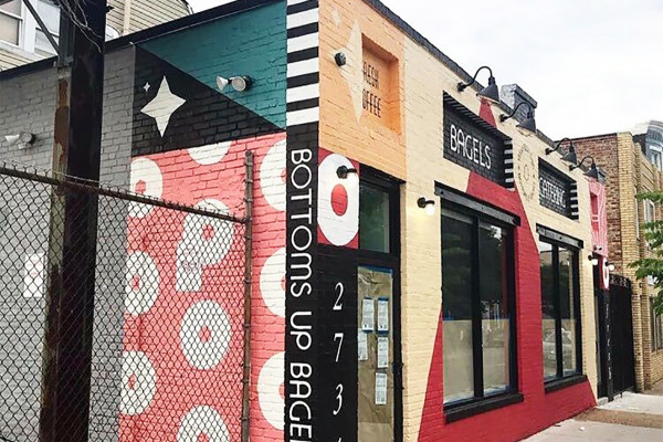  The exterior features colorful, mid-century modern murals by local artist Bobby Coleman. Photography by Bobby Coleman